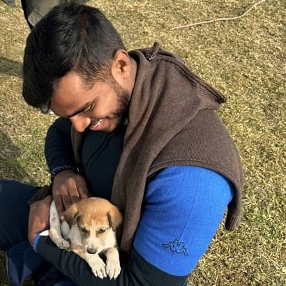Dev Sebastian holding a puppy